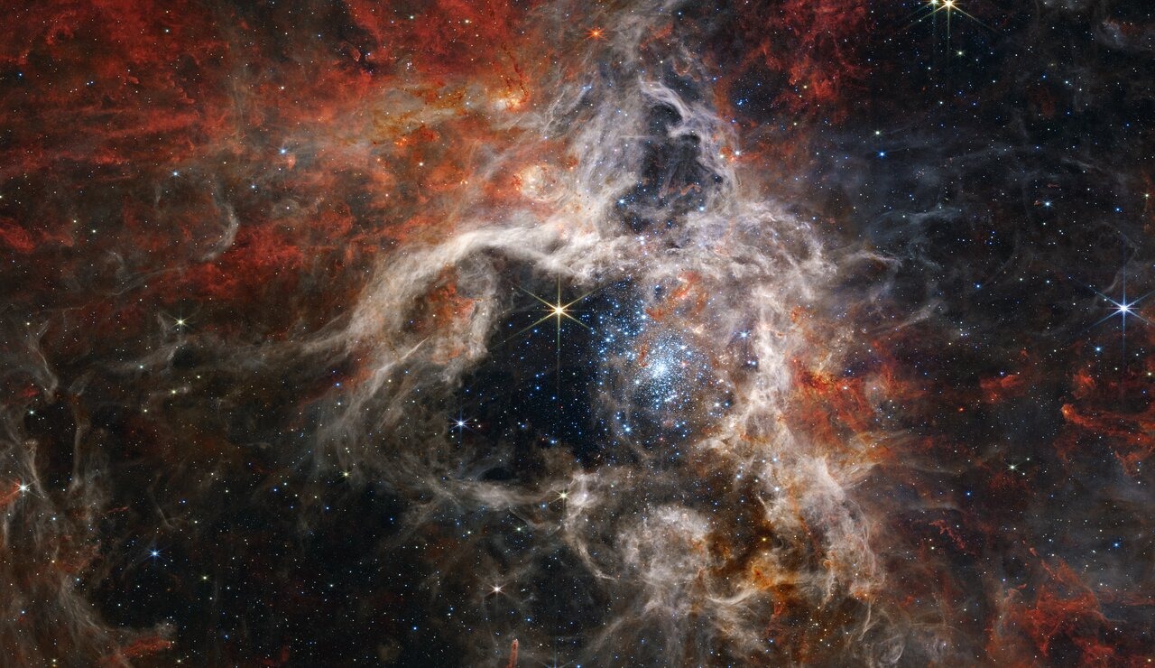A giant star forming region is revealed by the Webb in new light.