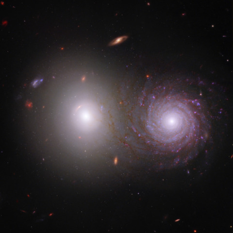 Two galaxies with the spiral in front of the elliptical
