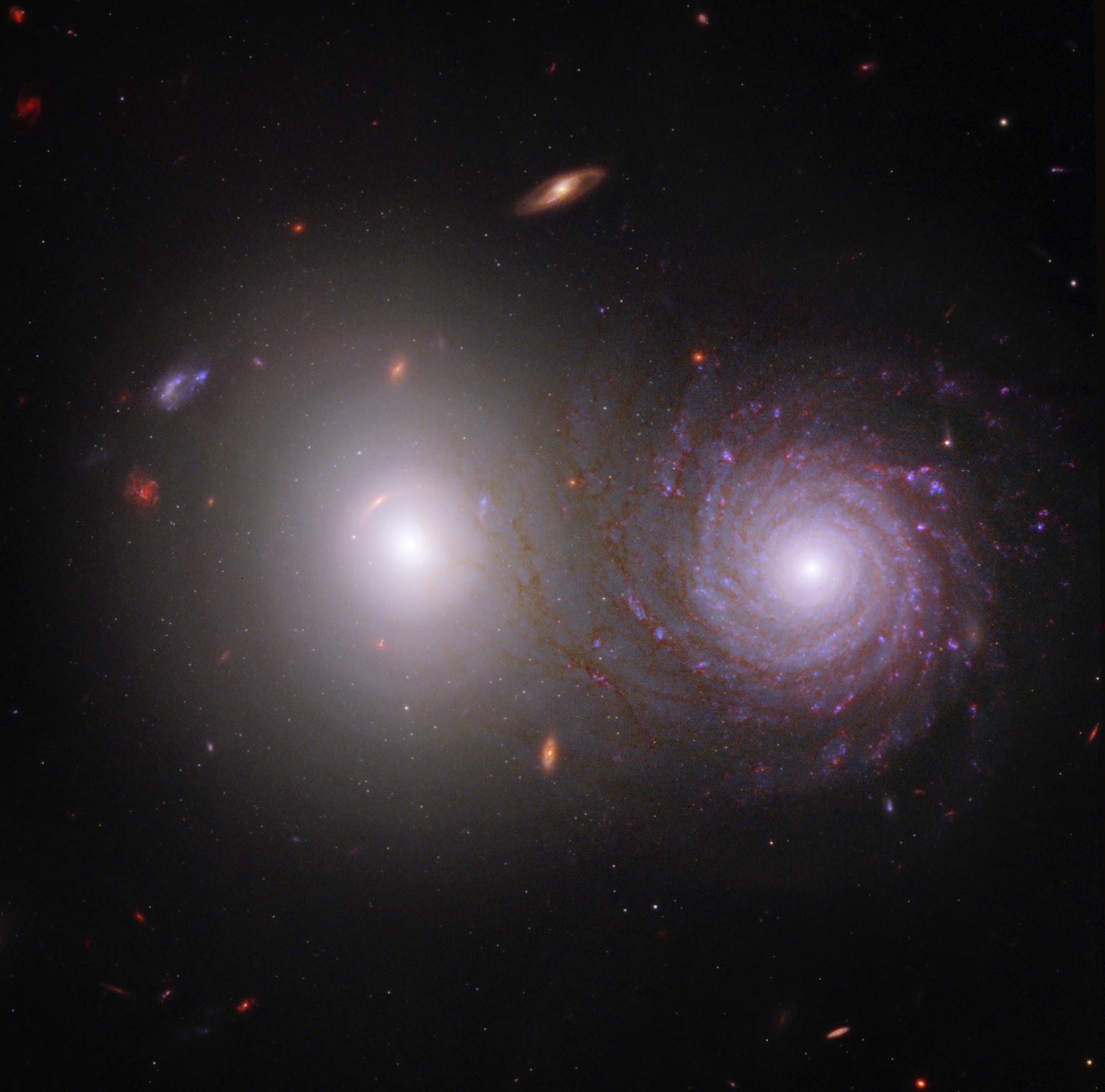 Two galaxies with the spiral in front of the elliptical